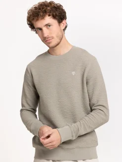 Sweat uni motif poitrine homme